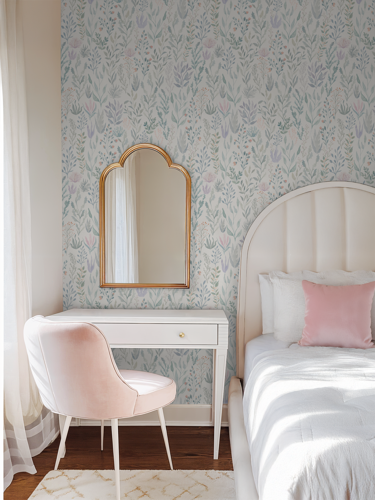 Pastel floral wallpaper in mermaid theme ocean bedroom with upholstered headboard white desk and pink chair.
