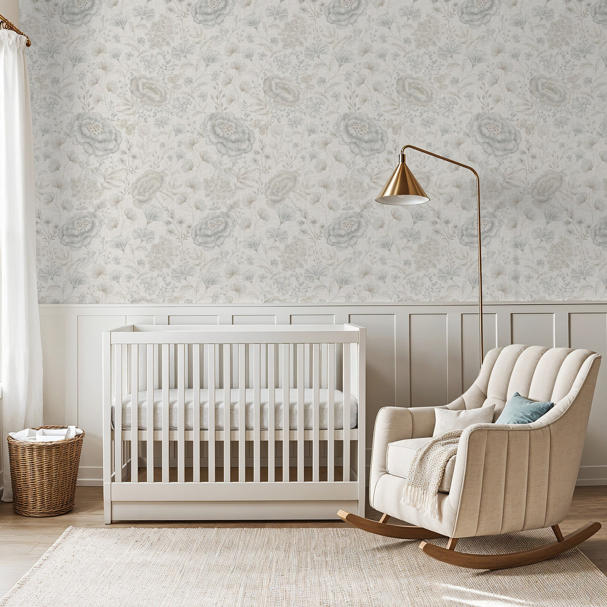 Pottery & Linen Floral wallpaper above white wainscoting in a soft blue and cream nursery with a white crib.