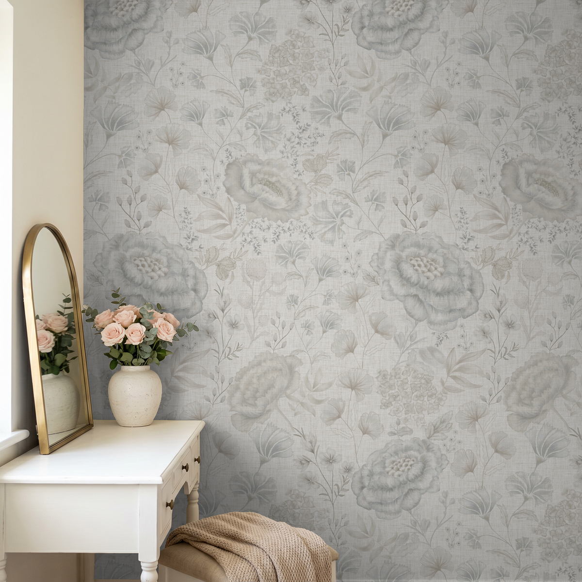 Pottery & Linen Floral wallpaper behind a white dresser with blush flowers and a vintage-style mirror.