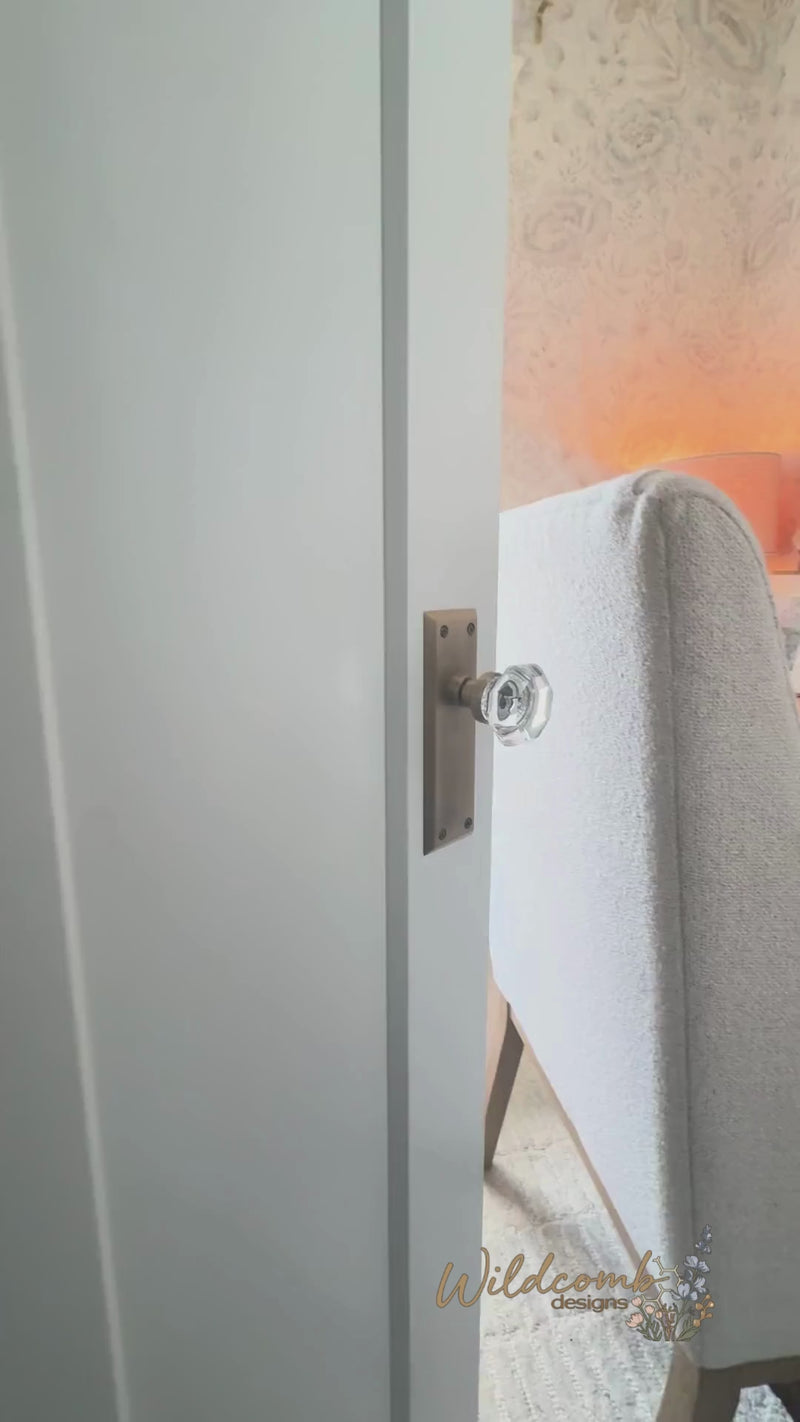 reveal video of small office space featuring pottery barn sea drift furniture and floral wallpaper in neutral tones