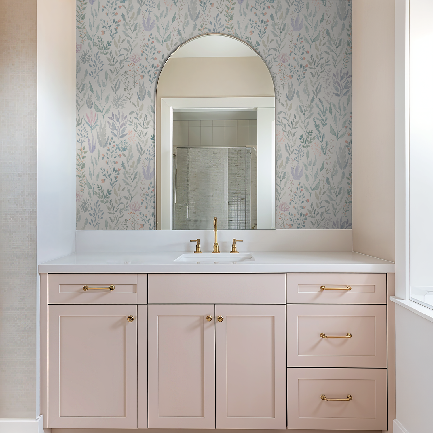 Bathroom with seafoam and lavender floral reef ocean coral wallpaper and pink cabinetry