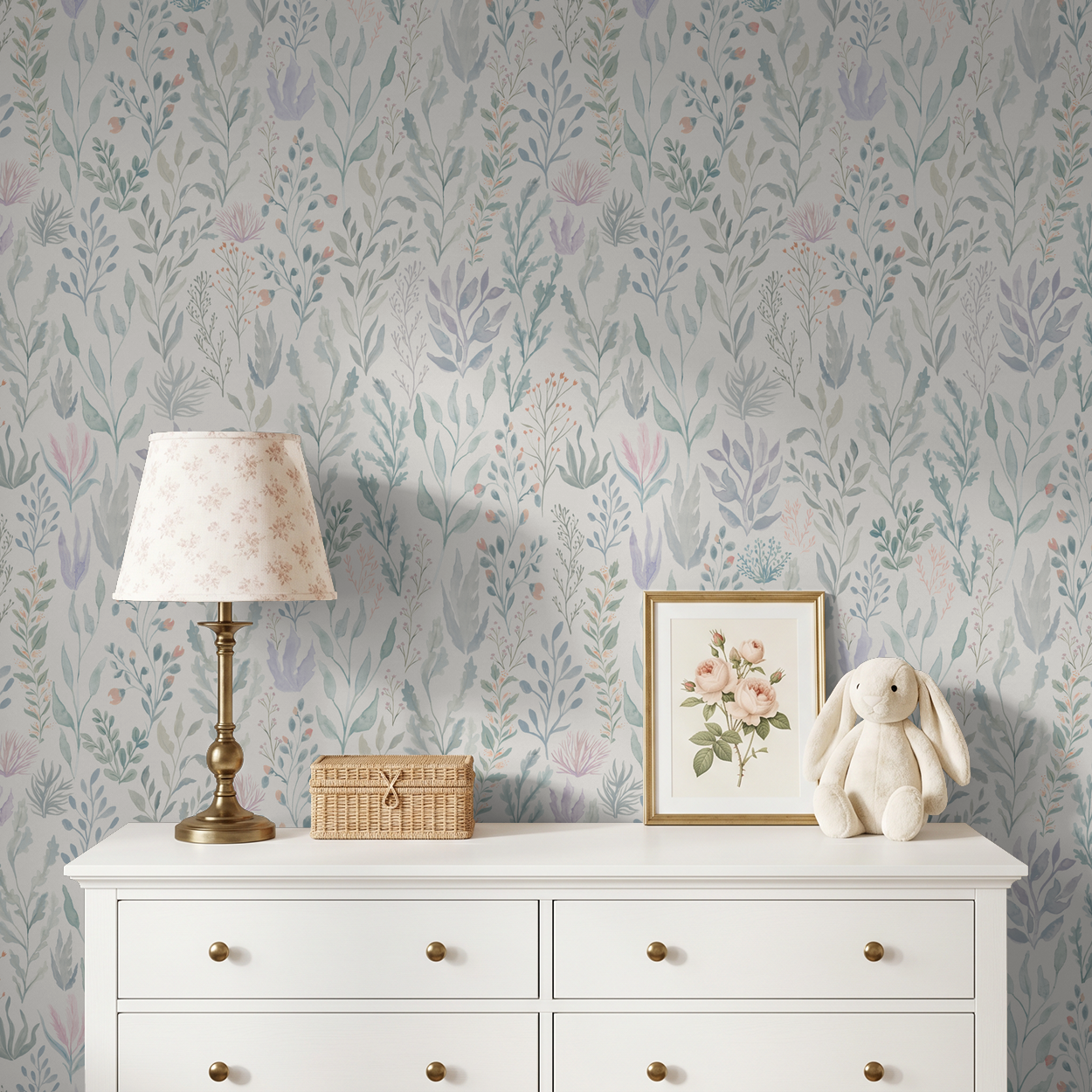 Serene floral wallpaper in seafoam and lavender in cozy nursery with white dresser.