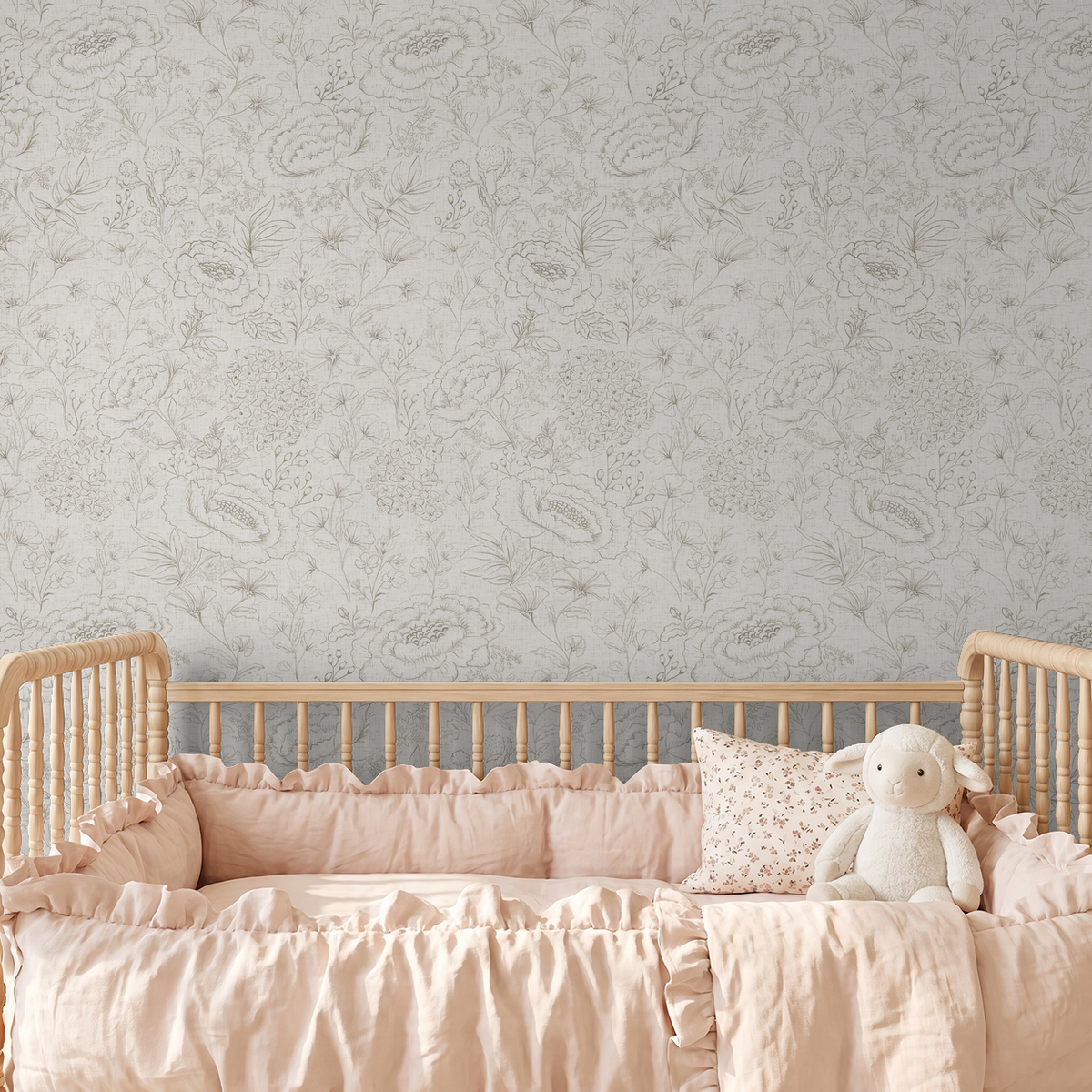 Pottery & Linen Sketch wallpaper in a soft pink nursery with a natural wood crib and delicate botanical line art.