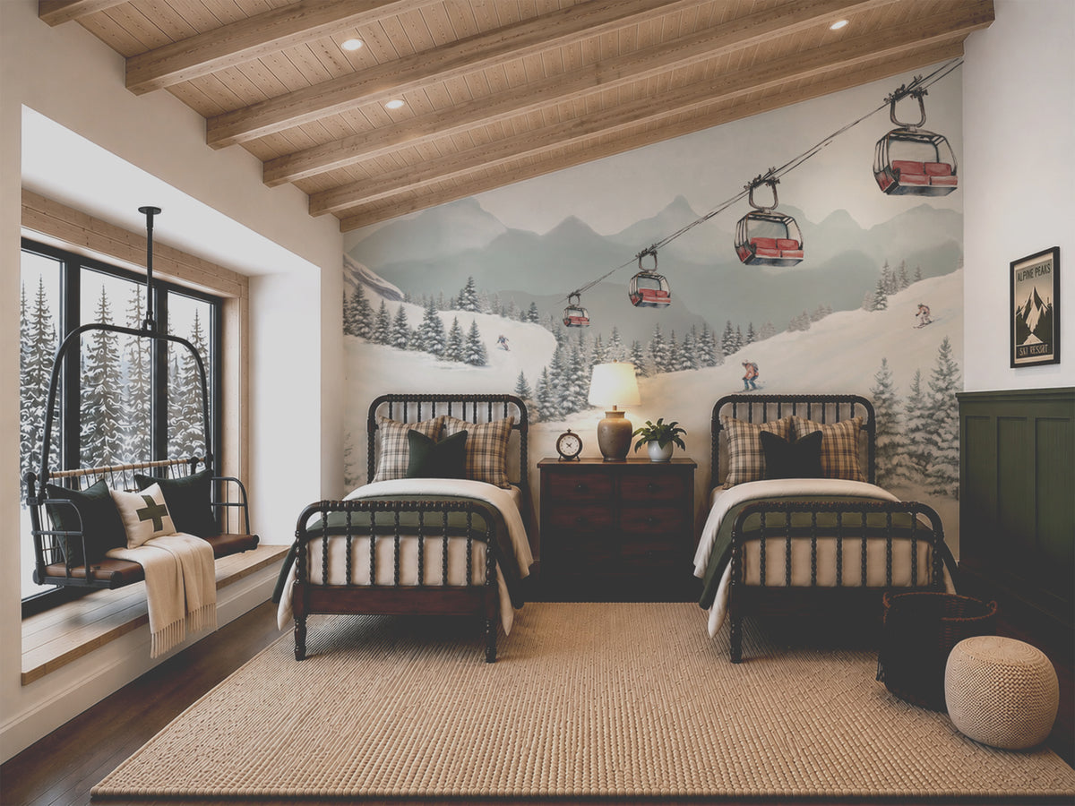 A styled ski lodge bedroom featuring two twin beds with striped bedding, a dark wood nightstand, a large wall mural of a mountain ski resort with chairlifts, a window with a hanging swing chair, and light wood ceiling beams.