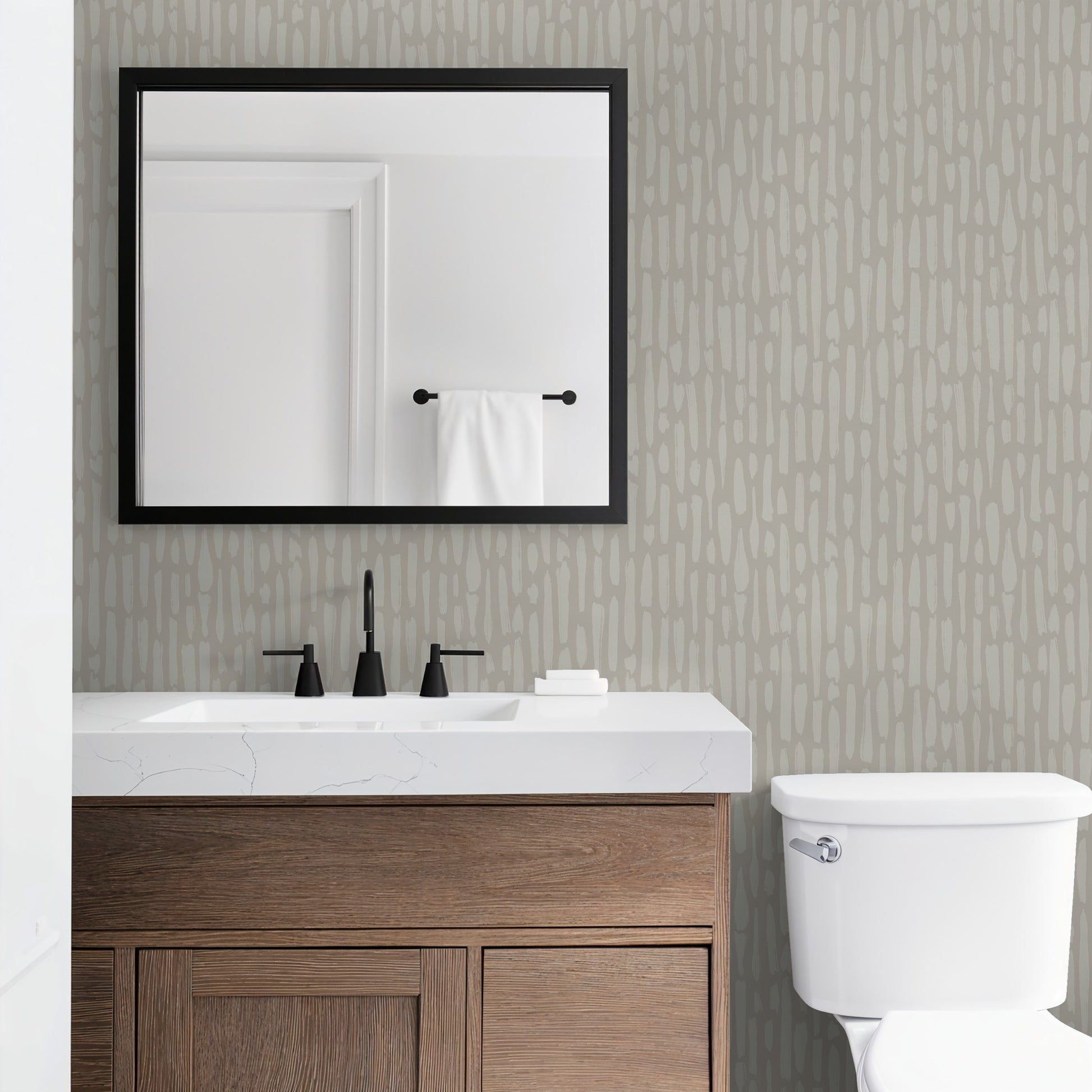 Tone-on-tone brushstroke wallpaper in modern bathroom with warm wood vanity