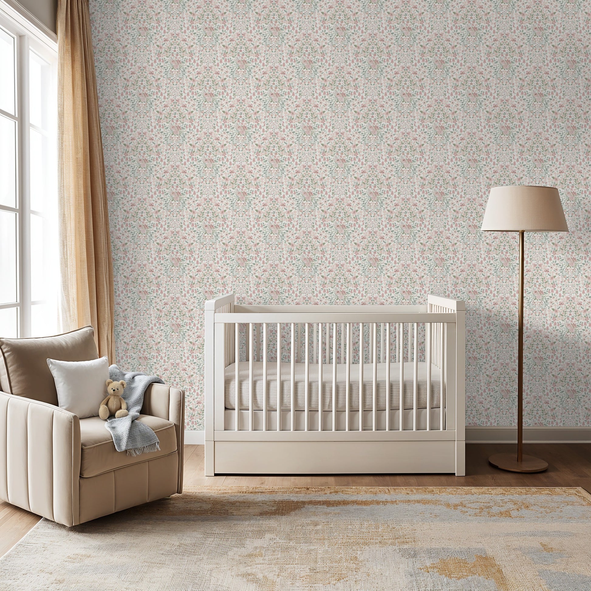 Soft neutral nursery with vintage-inspired floral wallpaper, cream crib, and reading chair.